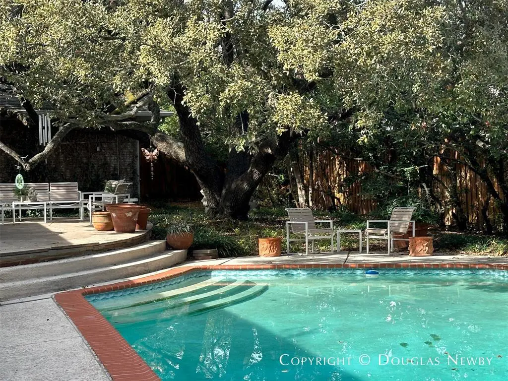 A heritage oak tree (protected by a deed restriction) defines the well-shaded property.   (Photo by Douglas Newby & Associates)