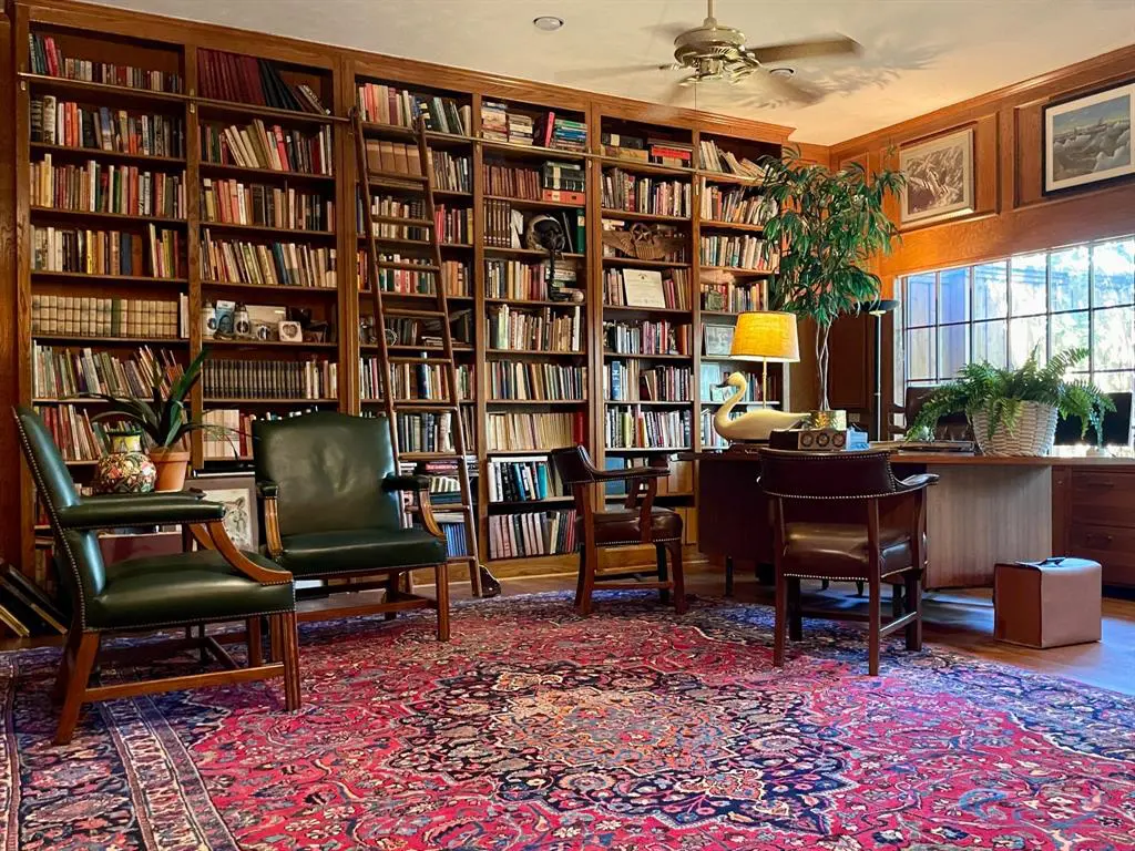 An office and library with floor-to-ceiling bookshelves was added to the home and overlooks the backyard gardens.  (Photo by Douglas Newby & Associates)