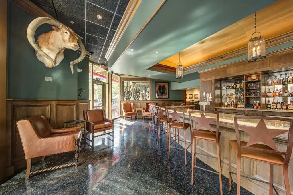 The arched, marble-topped bar greets visitors at the new Reata location.
