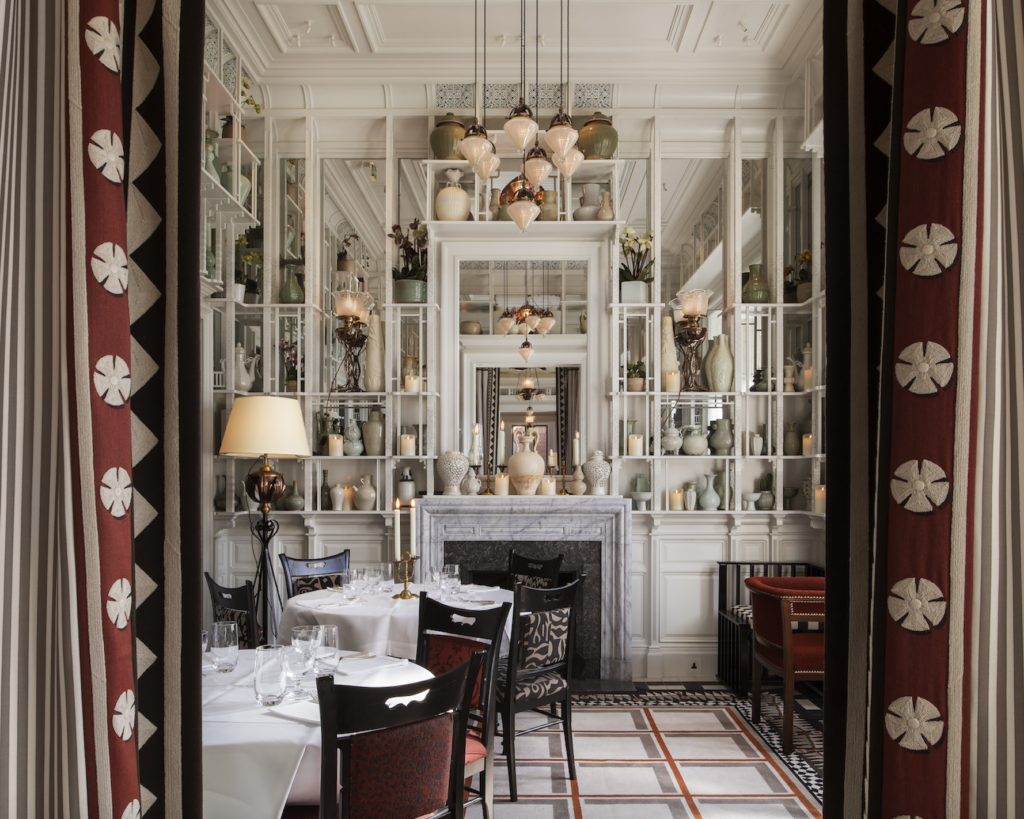 The Sloane Hotel restaurant salon designed by François- Joseph Graf, with a wall of celadon Chinese porcelain.