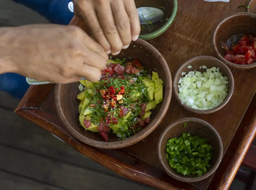 Tableside guacamole is one of the many mouthwatering food options overlooking the beach at Rancho Santana.