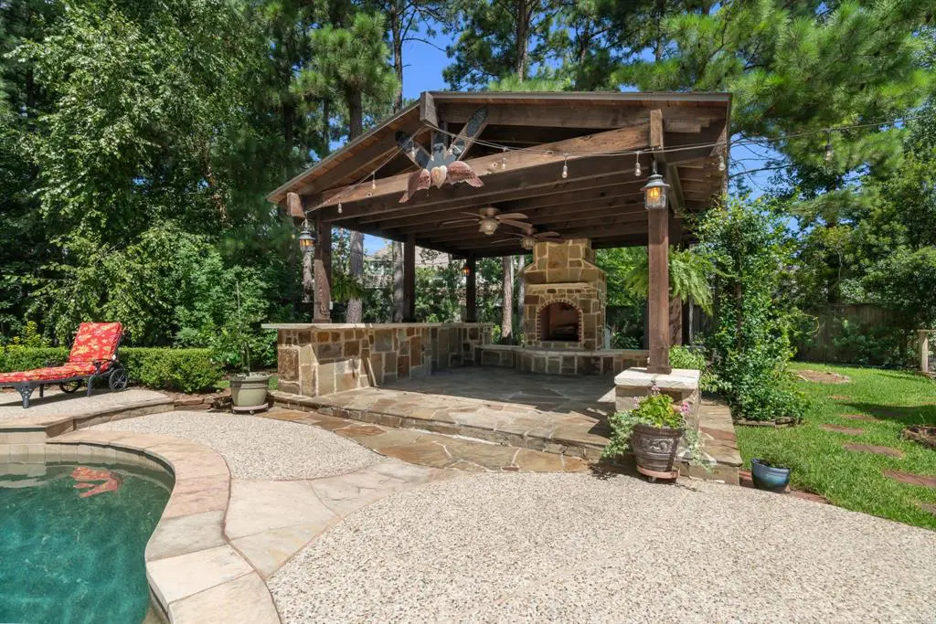 Outside, enjoy 71 E Hullwood Court's backyard oasis. 