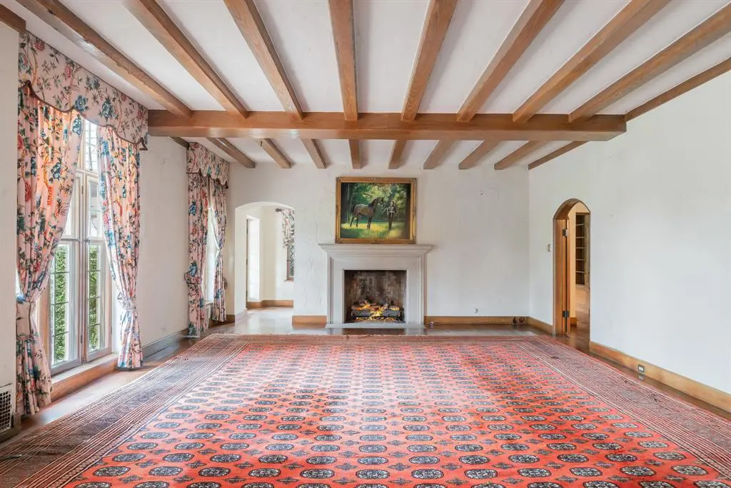 The stunning formal living area features a portrait of former owner Marilyn Hoffman.