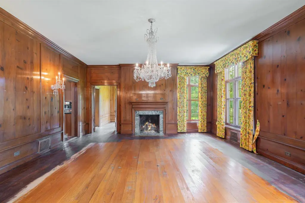 Last used as a formal dining room, this space is home to one of eight total fireplaces. 