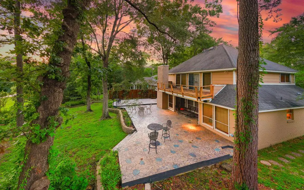 The two-story patio is perfect for enjoying views of the golf course at The Woodlands Country Club. 