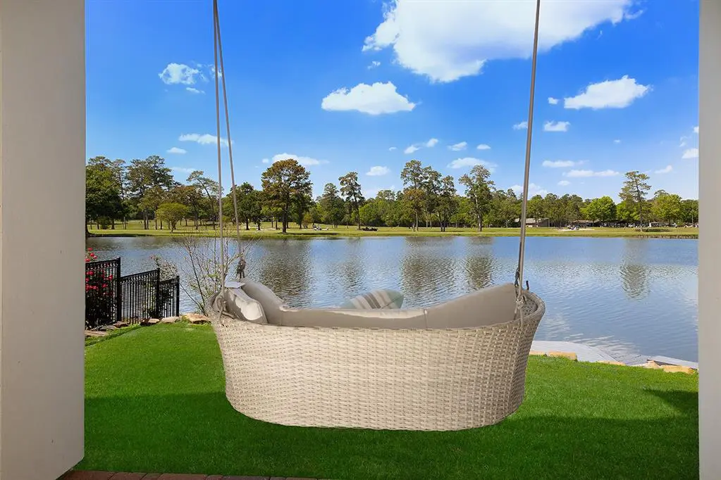 Outside, enjoy peaceful views of Lake Harrison from the backyard.