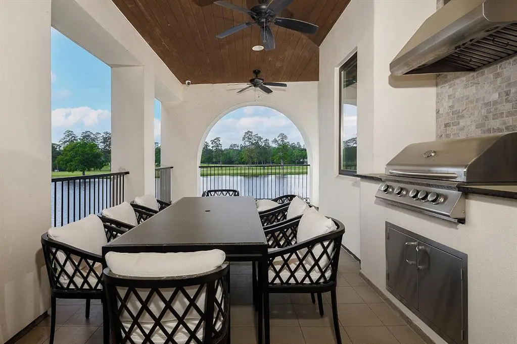The balcony includes an outdoor kitchen and plenty of space to entertain friends and family. 