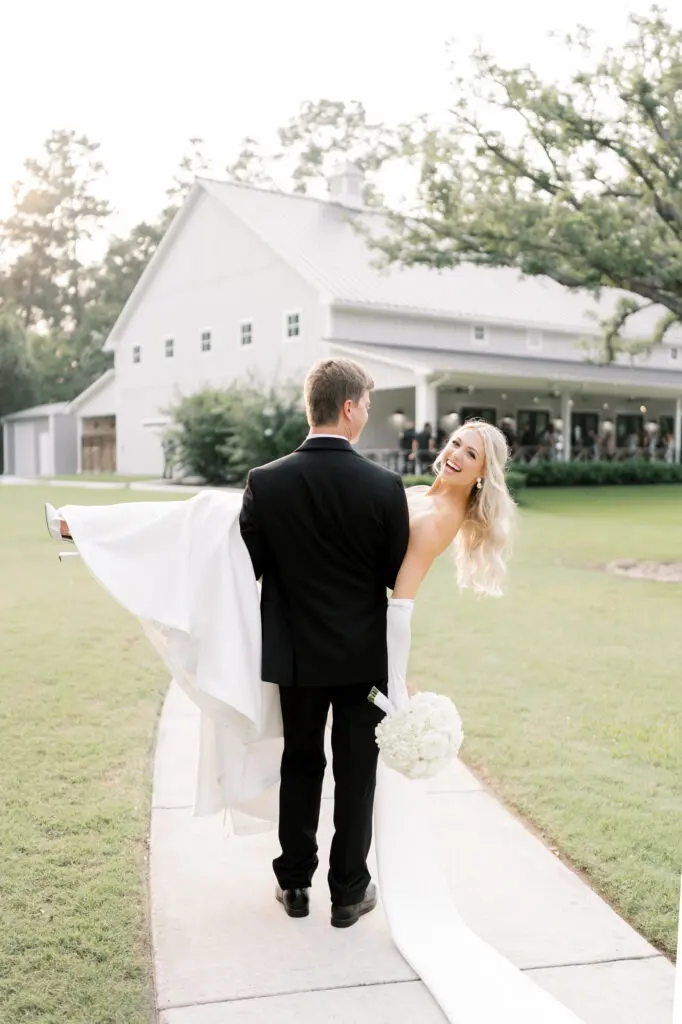 The path from chapel at Addison Woods to the reception hall is the perfect venue for a quick photo while guests enjoy cocktails on the porch. (Sweet Nest Photography)