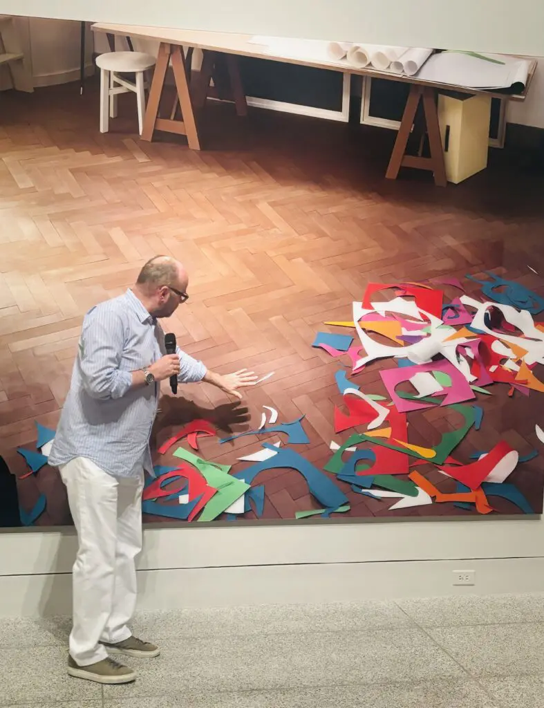 Artist Thomas Demand discusses his photograph "Atelier," 2014, at the Museum of Fine Arts, Houston. This artwork was inspired by photographs of French Fauvist artist Henri Matisse's paper cut-outs made in his studio at the Hôtel Régina in Nice, France. (Photo by Ericka Schiche)
