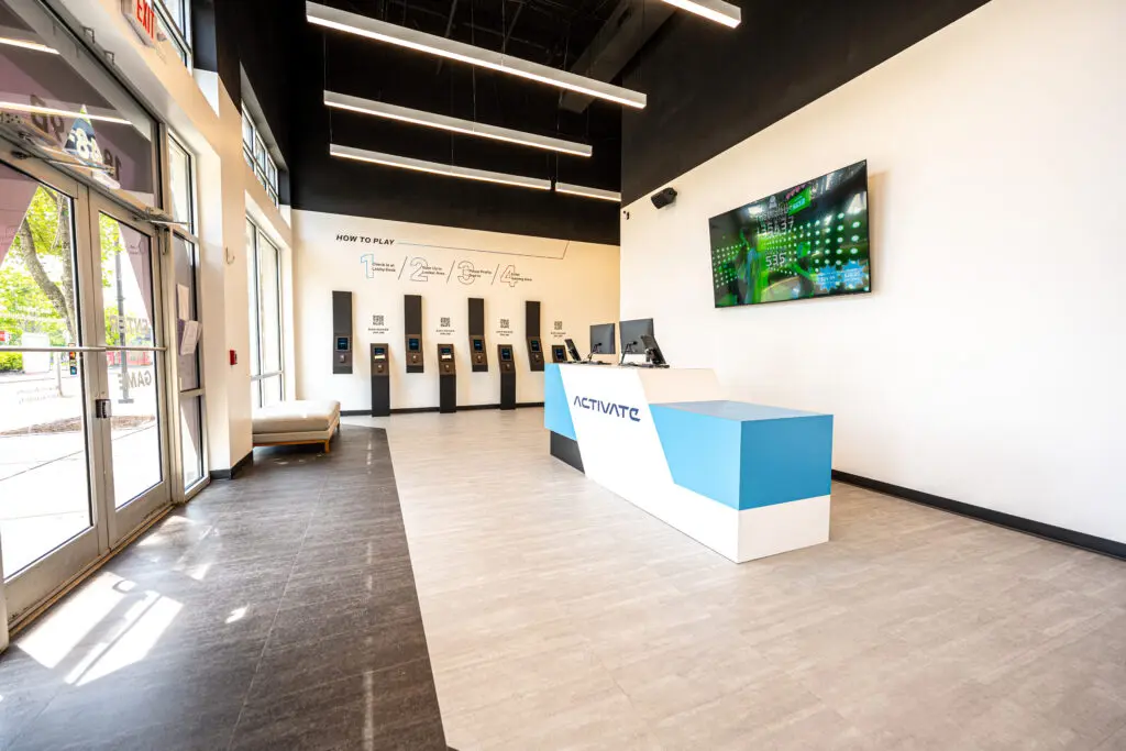 Activate's lobby is designed to take players though the sign in process quickly and easily. Screens throughout the area lets players know where they rank as they play.