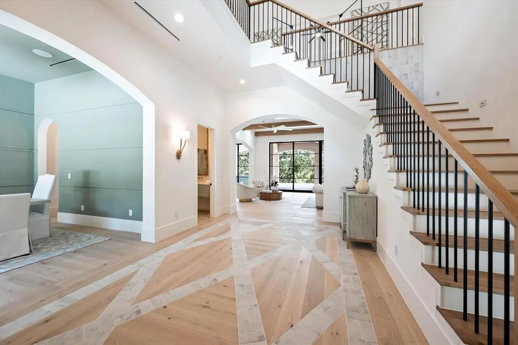 The details unfold as soon as you enter 3211 Wintergreen Terrace, like the inlaid tile and white oak design under foot.
