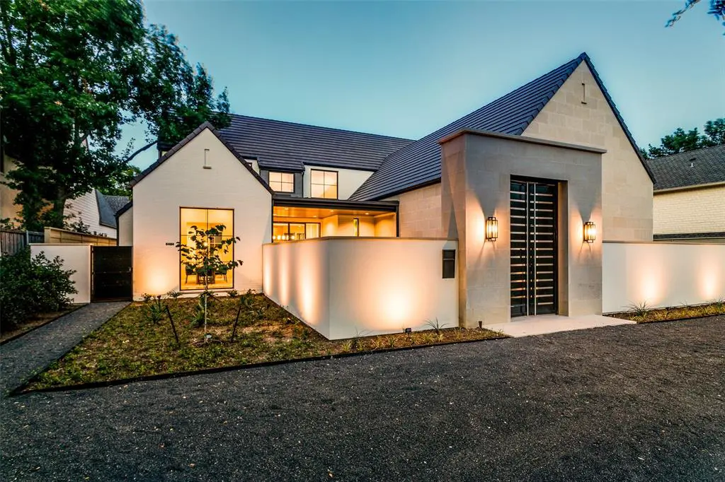 The 7,600-square-foot beauty in Bluffview has fit nearly every possible modern amenity onto its .5-acre lot. 