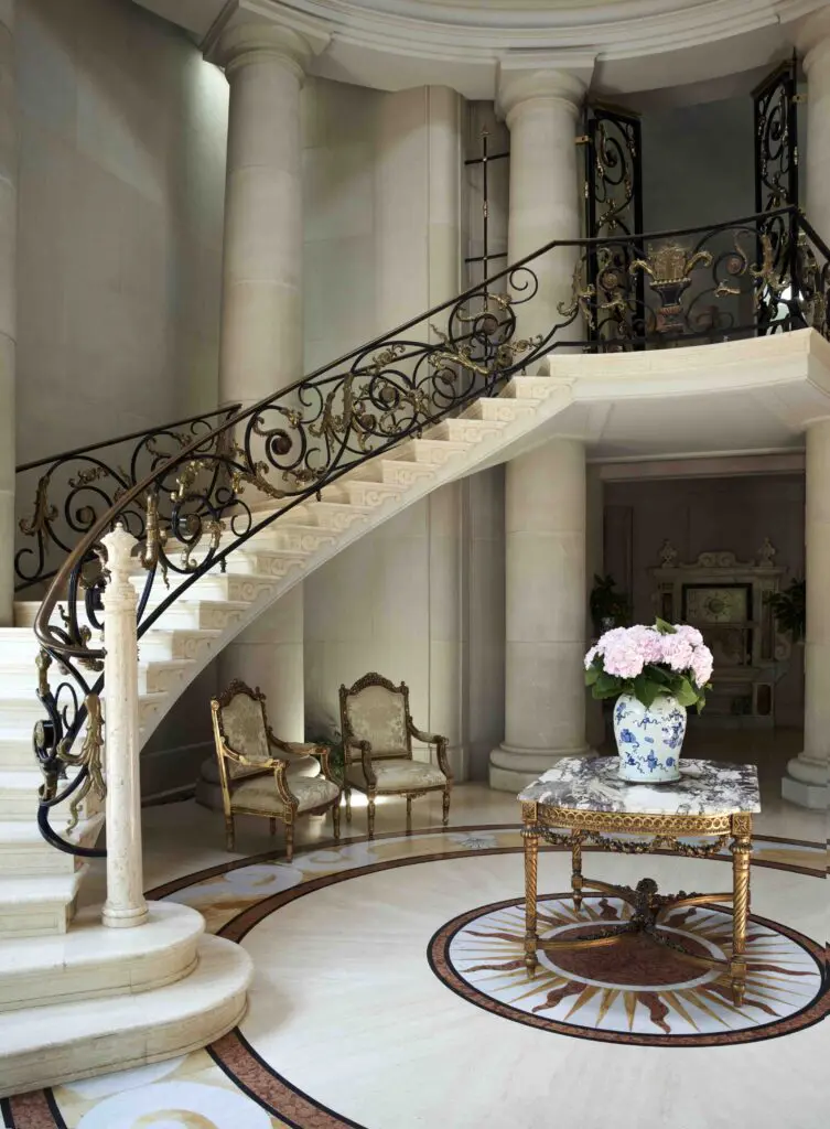 The Young Estate's spectacular foyer, designed by Billy Baldwin protégé Michael Morrison in the ‘70s, with polished travertine floors and marble sun design. (Photo by Pär Bengtsson)
