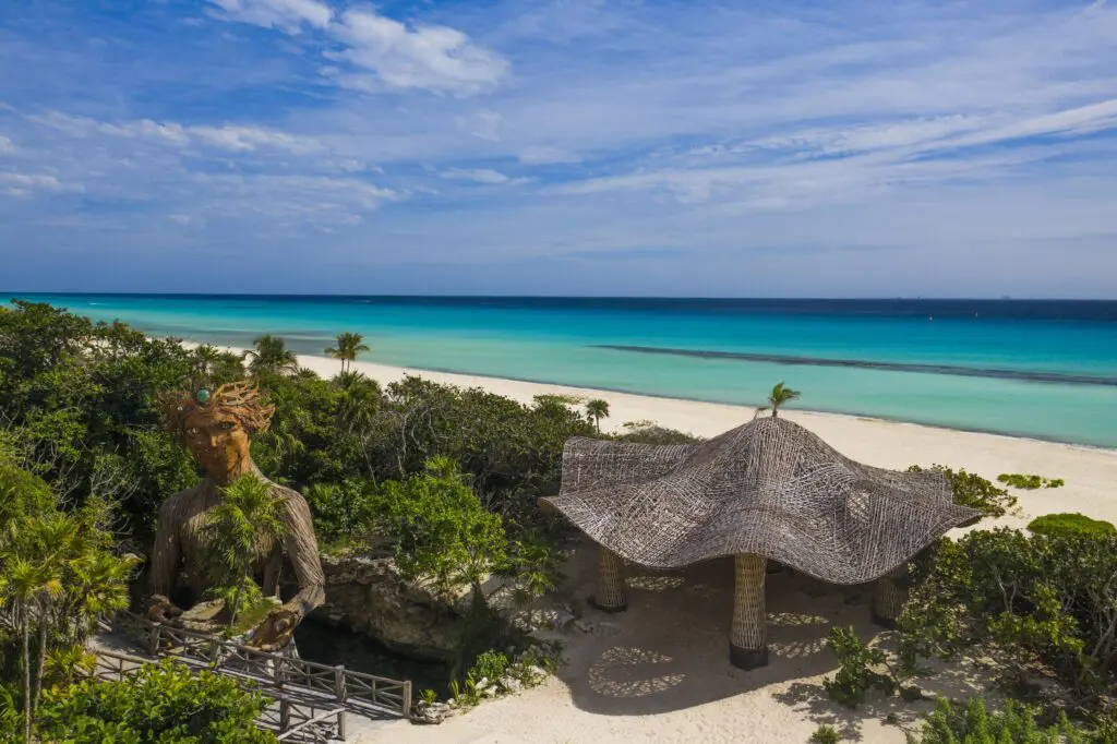 Art and movement classes at Palmaïa-The House of Aïa take place beneath this charming thatched canopy, right on the soft sands of the beach. (Photo courtesy Palmaïa-The House of Aïa)