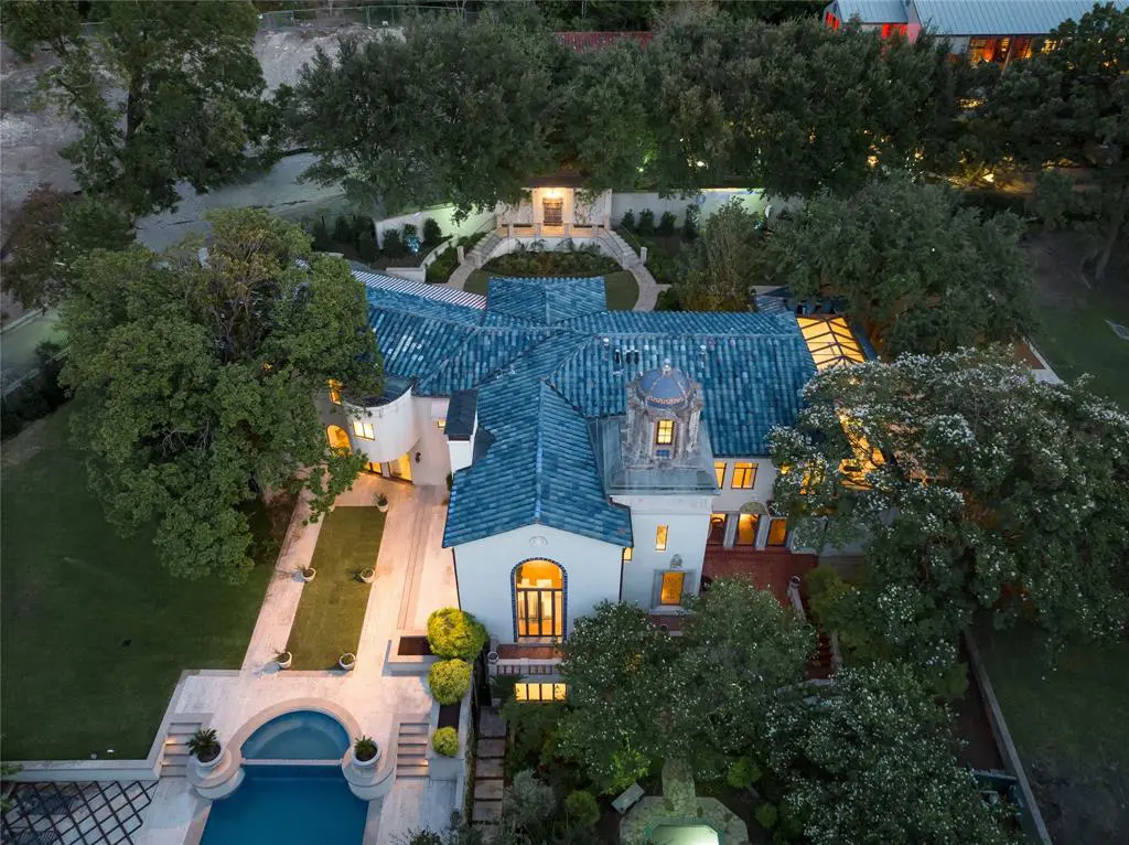 At 3828 Turtle Creek Drive, the architectural interest includes the blue tile roof and lavish loggias.