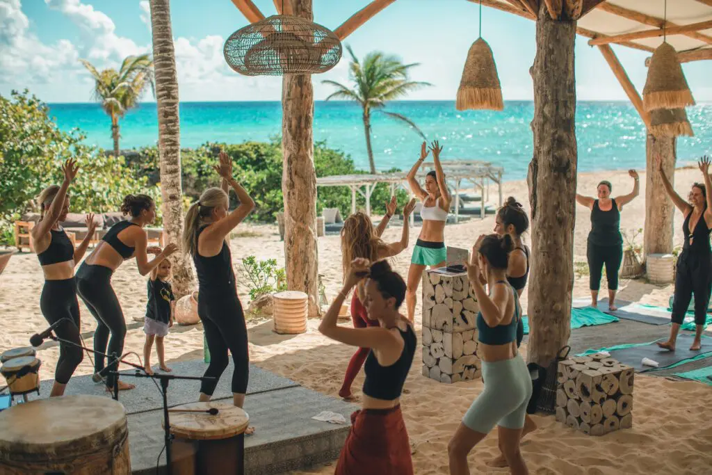 Wake up and meander to the beach and take in a morning yoga class outside at the Eolo Beach Club. (Photo courtesy Palmaïa-The House of Aïa) 