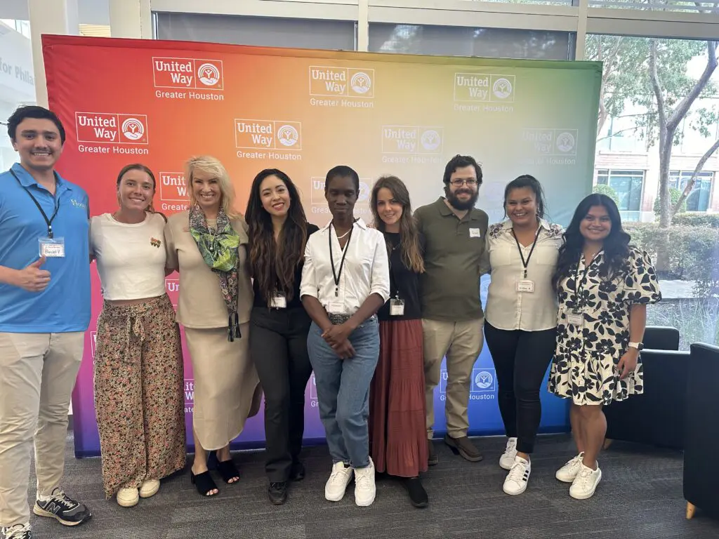 Daniel Vasquez, Sarah Yashinskie, Victoria Velarde, Kimberly Santos, Marquithia Gloud, Ines Diaz, Bernardo Galker, Karen Orellana, Katherine Orellana celebrate the organization's 20th anniversary. (Photo courtesy of Victoria Velarde)