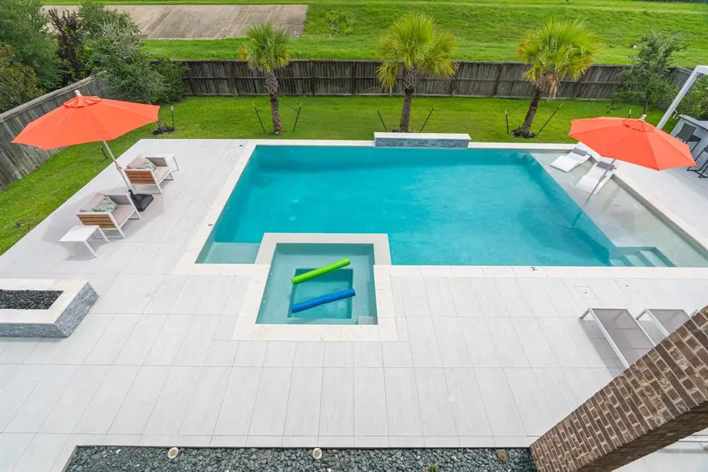 The contemporary swimming pool design is one of the home's main perks. Enjoy this space for years to come. 