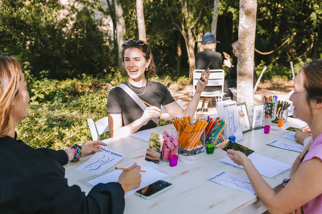 Artist Haley Bowen shows attendees how to draw contour lined self-portraits at PaperCity's Nourish retreat. (Photo by Heather Robards)