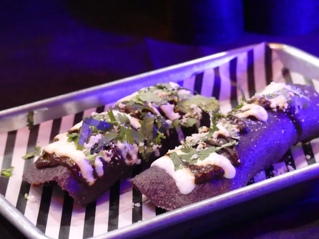 There are many spooky drinks and bites to try at the "Beetlejuice" pop-up at The Whippersnapper like Sandworm Tacos.