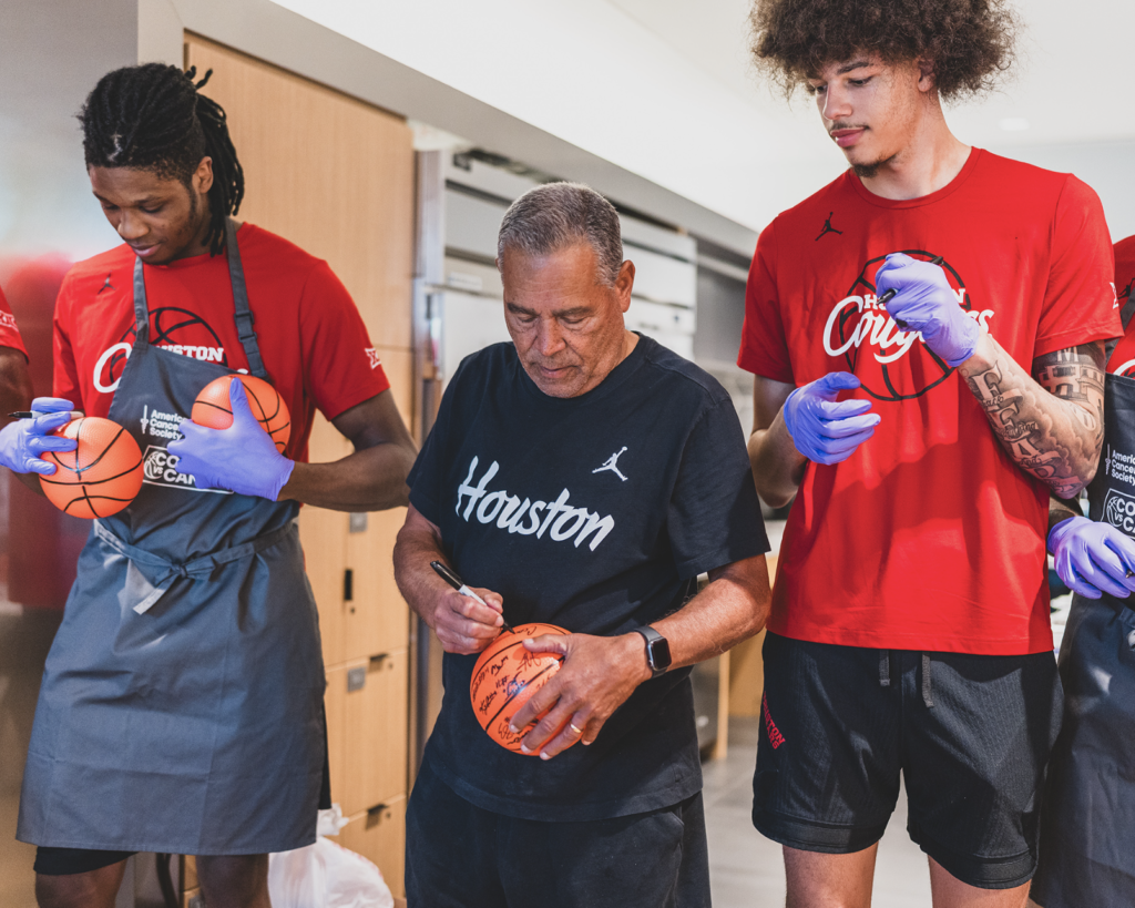 University of Houston center Jacob McFarland (right) is always eager to jump in and help out.(@UHCougarMBK)
