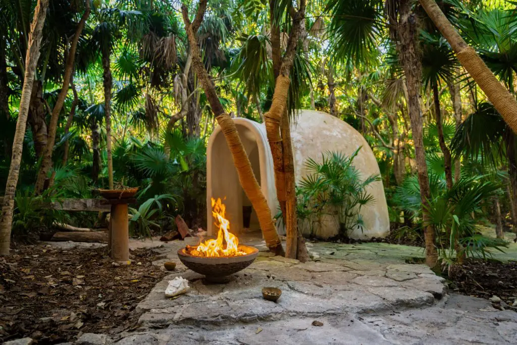 The Atlantis Spa, tucked away in the jungle, provides ancestral treatments and relaxation spaces near cenotes, including a traditional Pre-Hispanic Temazcal. (Photo courtesy Palmaïa-The House of Aïa)