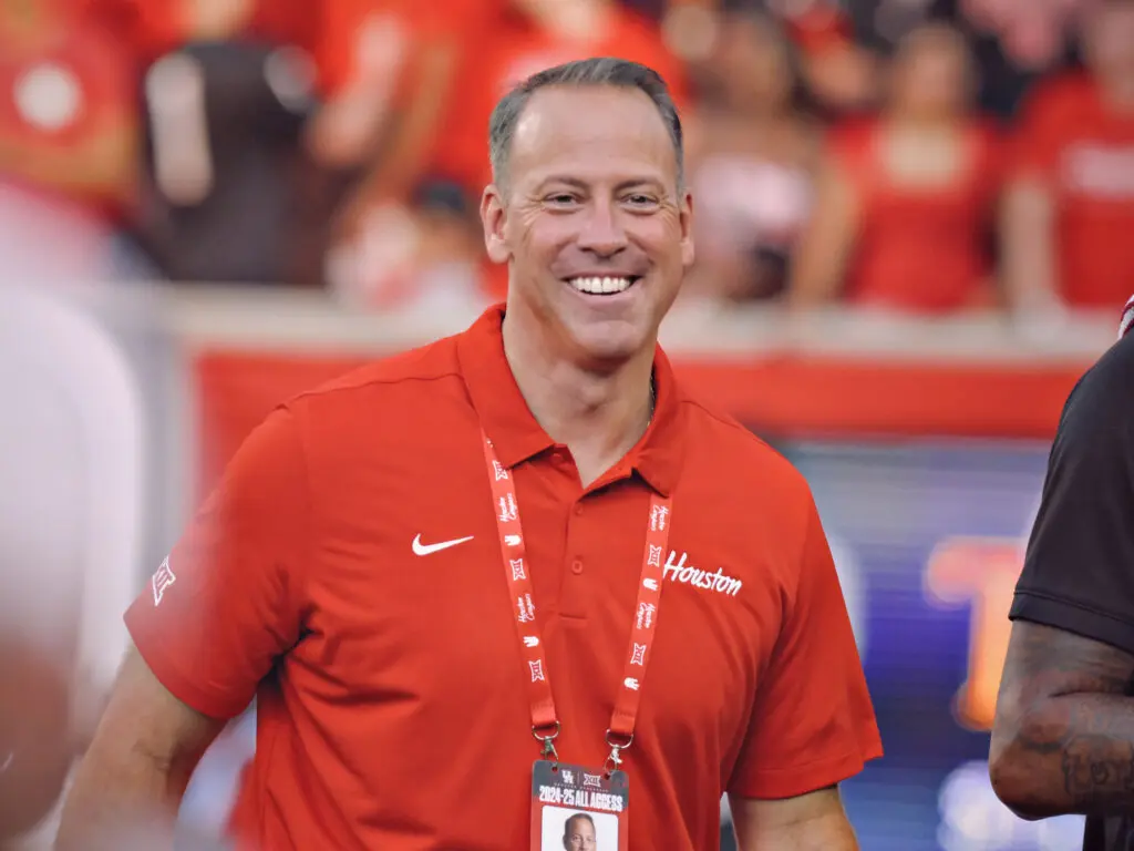 University of Houston athletic director Eddie Nuñez knows that two Big 12 teams in the playoff field helps Willie Fritz's UH program too. (Photo by F. Carter Smith)