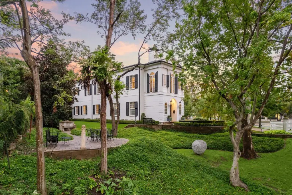 Luscious gardens complete with a spacious patio surround the house at 6024 Memorial Drive in Glen Cove.