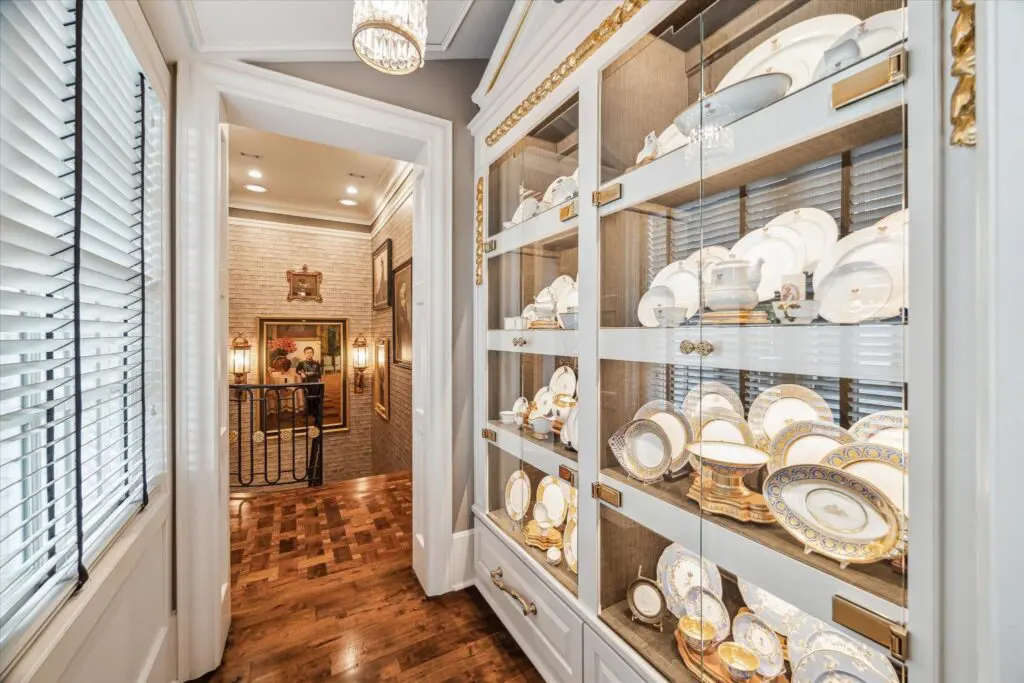 A floor-to-ceiling Welsh-style cabinet in the kitchen is perfect for displaying decorative dishes at 6024 Memorial Drive.