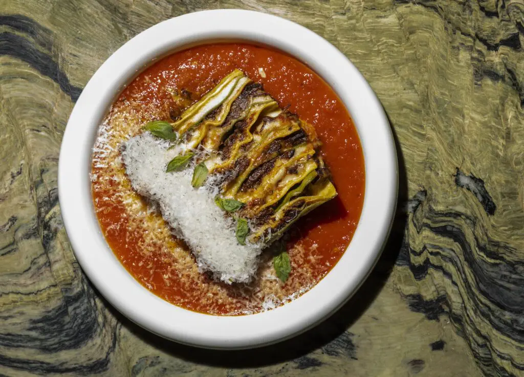 Milton's dish that’s caught the attention of many diners is the 100-layer lasagna. For the uninitiated, it’s made with semolina pasta, spinach pasta, béchamel, oxtail ragu and tomato sauce, repeated again and again (20 times in total). (Photo by Julie Soefer)