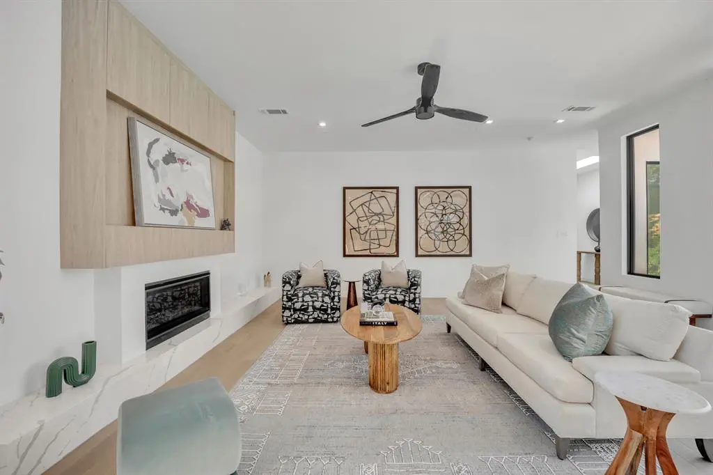 The homes features offers a first-floor primary suite with direct courtyard access.