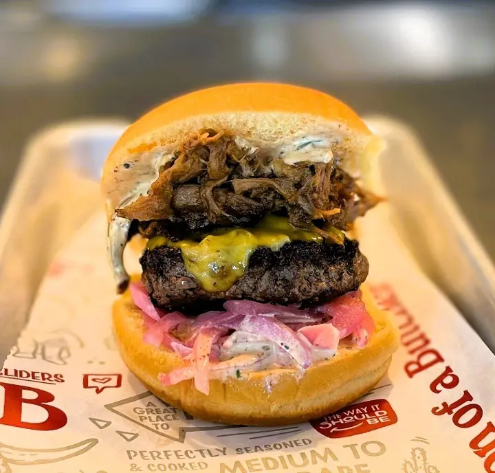 Son of a Butcher tops a wagyu burger with smoked brisket and rosemary aioli on its Burnt Ends burger.