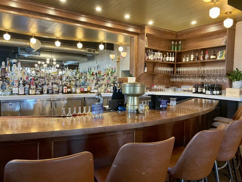 Clay Pigeon's copper topped bar has been refreshed with comfy new seating and a built-in mirror behind the bar back. (Photo by Courtney Dabney)
