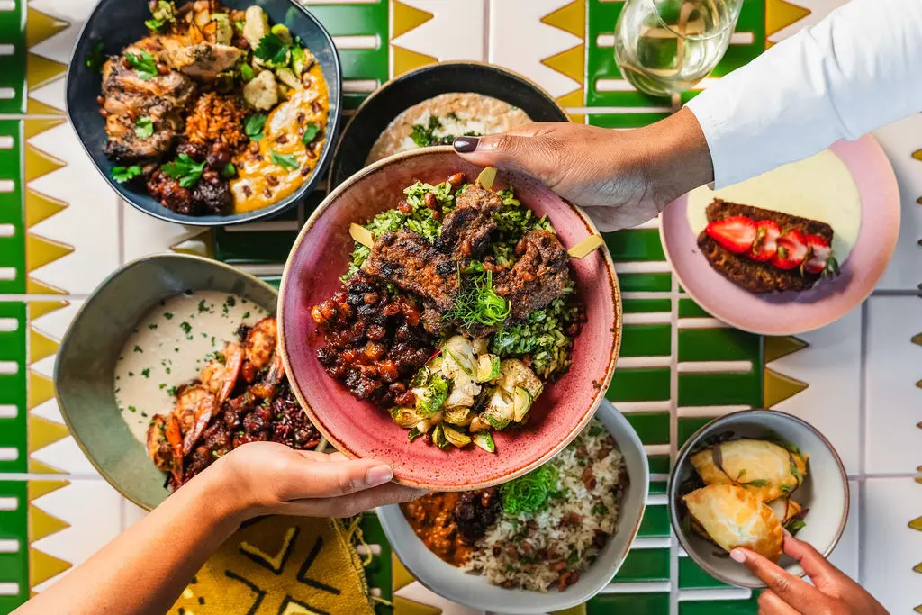 ChòpnBlọk's Greens + Tings Blok pairing features a delicious combination of Liberian rice and greens, roadside steak, yaji vegetables and stewed plantains. (Photo by StuffBenEats)