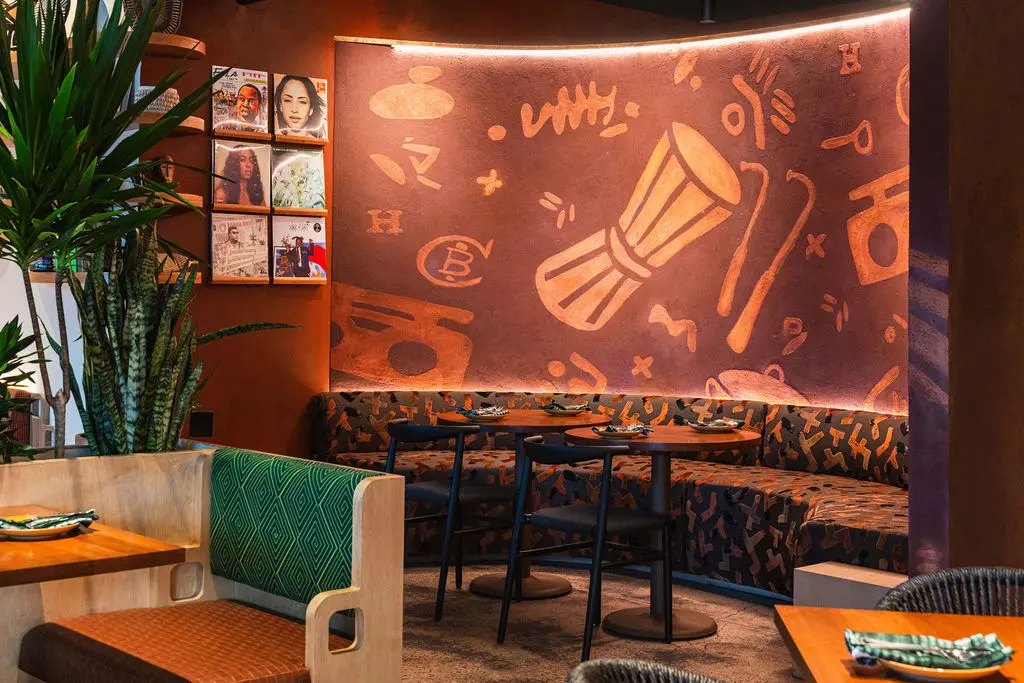 The stenciled mud wall highlights ChòpnBlọk's signature pattern. (Photo by StuffBenEats)