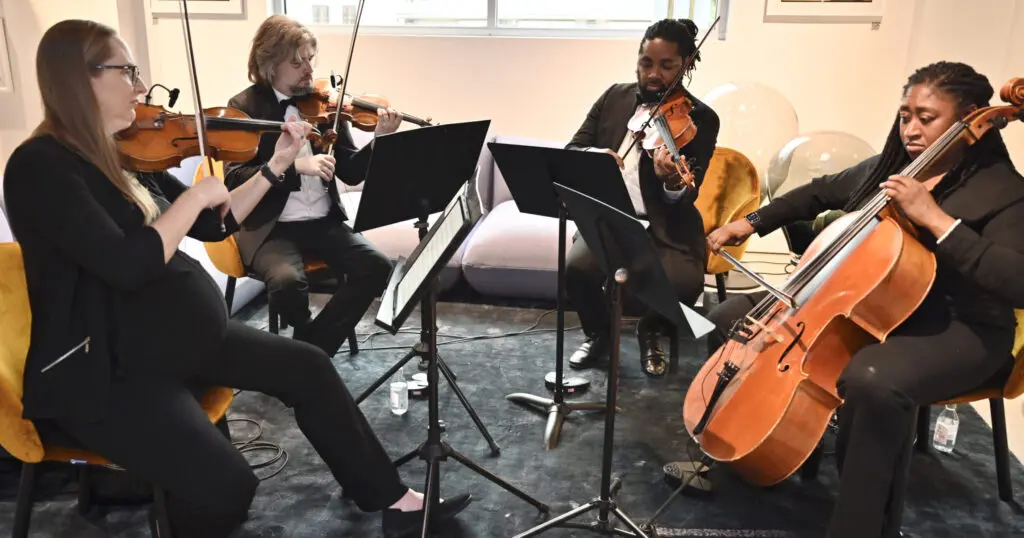 Divisi Strings performed classical and contemporary hits at Gala Design-Studio opening. (Photo by Alex Montoya)