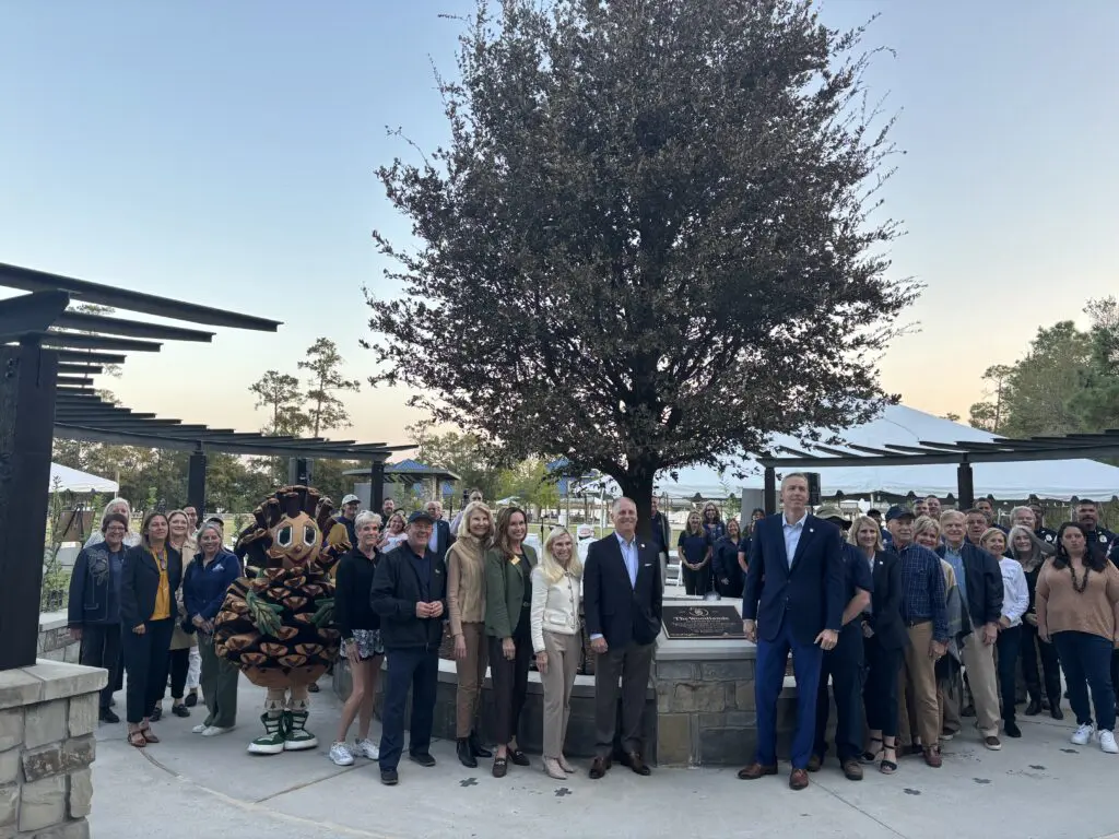 Members of The Woodlands Township board, Howard Hughes employees and guests at the tree dedication at Northshore Park. (Photo by Laura Landsbaum)