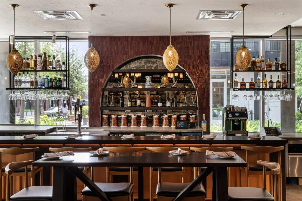 The bar at the newly reopened Mi Luna restaurant in the Montrose Collective leaves an impression. (Photo by Dylan McEwan)