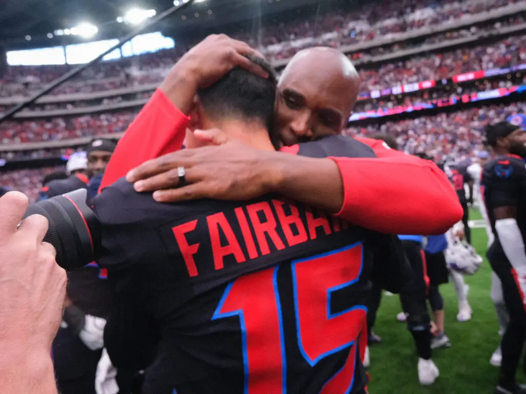 When you hit a walkoff 59-yard field goal like Ka'imi Fairbairn, you get a hug from Texans coach DeMeco Ryans. (Photo by F. Carter Smith)