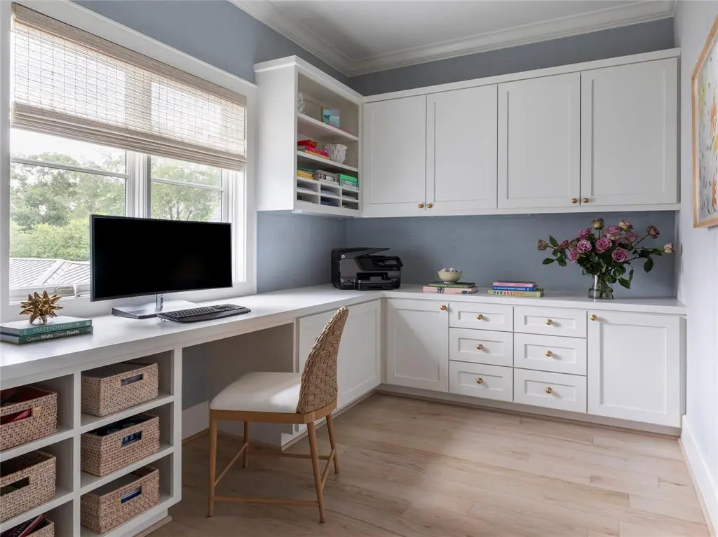 A spacious second floor home office just right for planning charity board meetings and vacation outiongs.