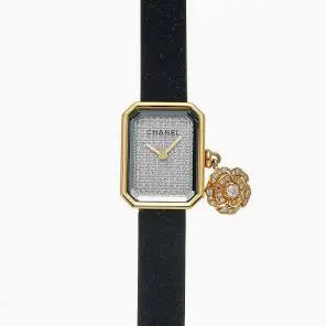 Chanel Première Extrait de Camélia 18K Yellow Gold, Titanium & Rubber Strap Diamond Charm Watch, available at Highland Park Village and River Oaks District. 