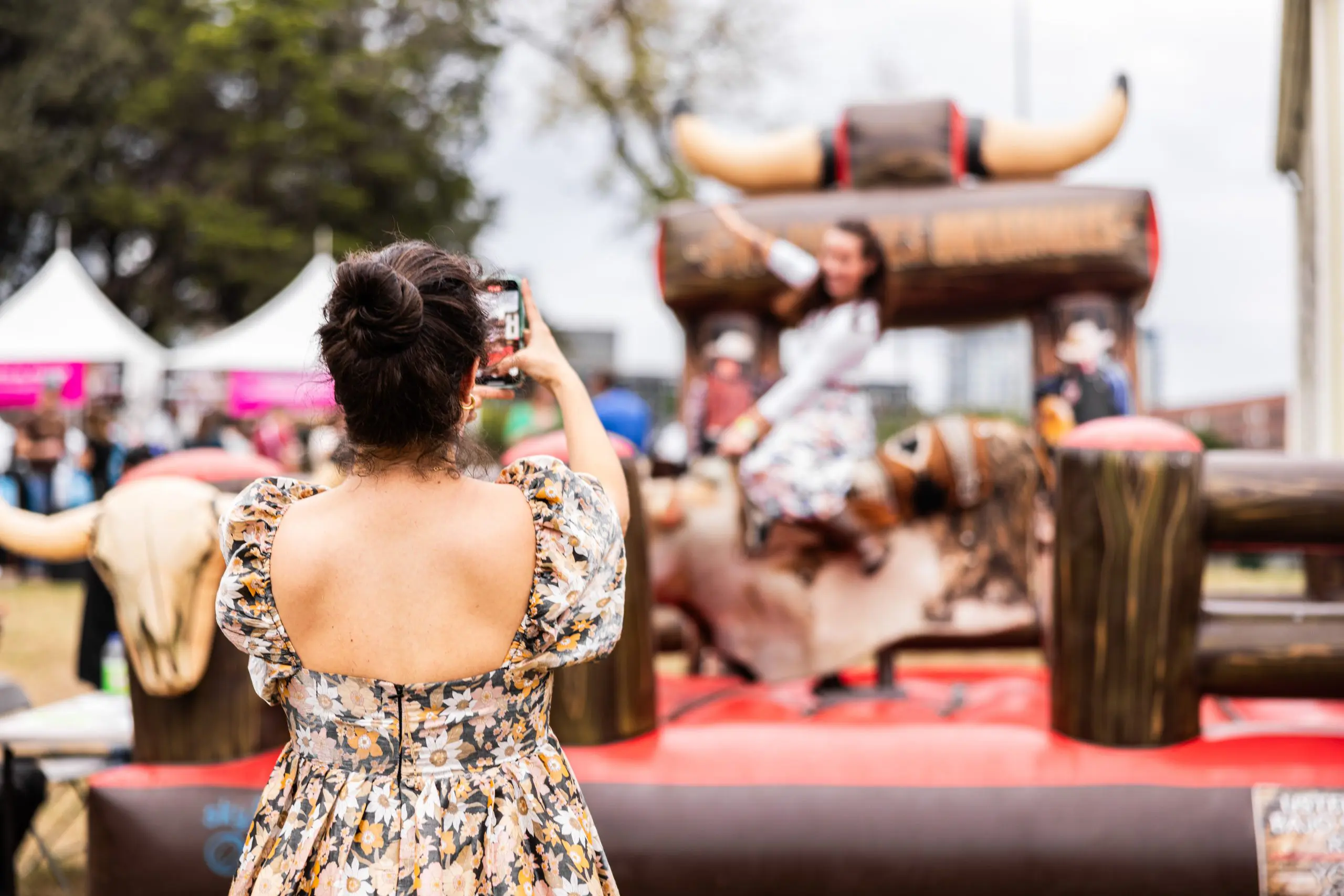 Adventure-seeking attendees enjoyed axe throwing and riding the mechanical bull. (Photo by Kathy Tran)