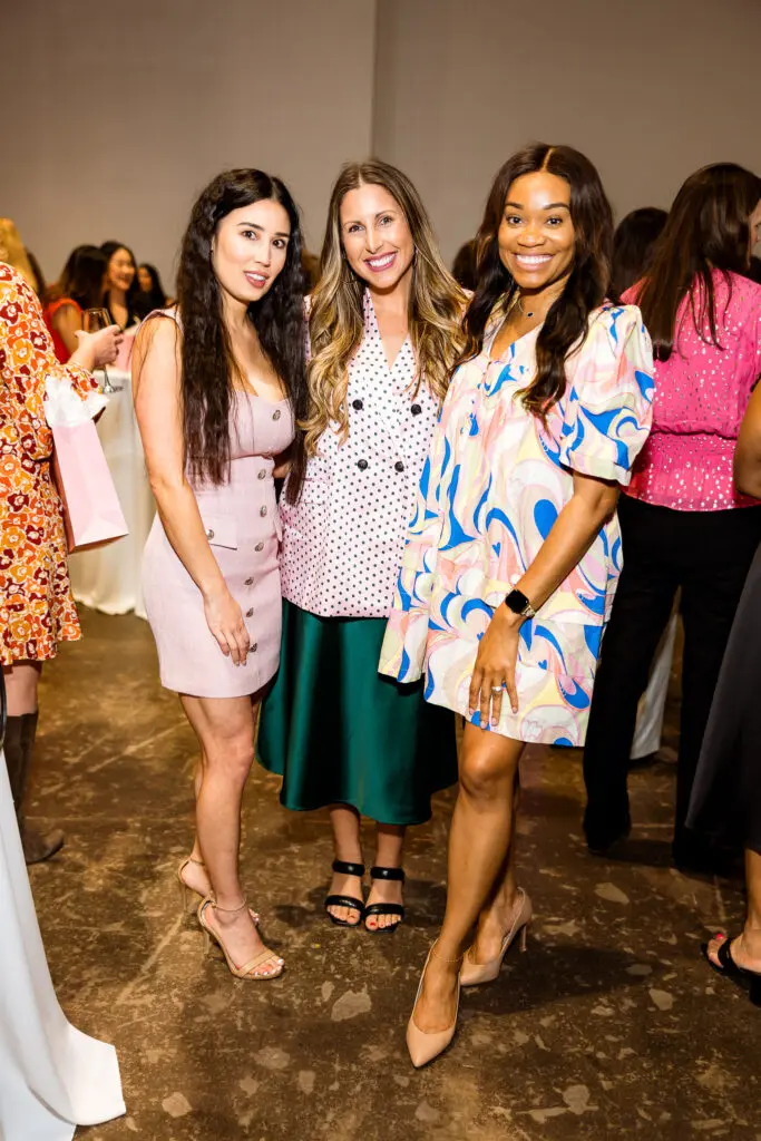 Michelle Hubbard, Danielle Grossman and Natalie Robinson make the scene at the Power of the Purse fundraiser benefiting Women's Resource. (Photo by Quy Tran)