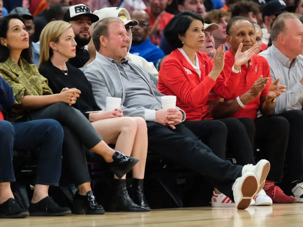 Tilman Fertitta and his wife Lauren (far left), UH chancellor Renu Khator and her husband Suresh often take in games together. (Photo by F. Carter Smith)