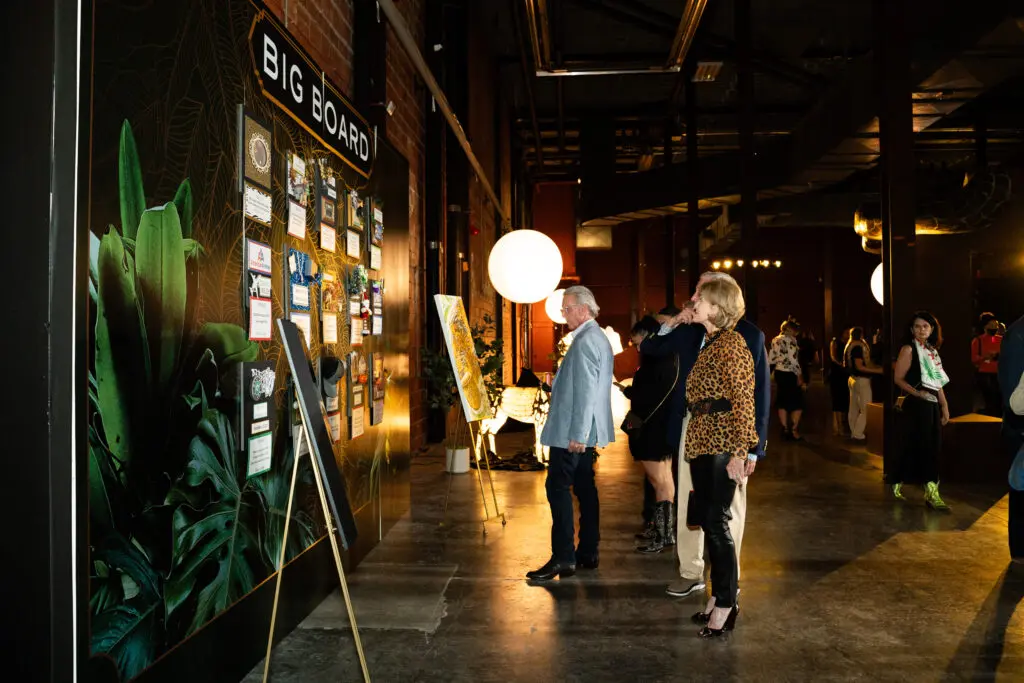 Guests and Big Board Auction (Photo by Susie Burleson)