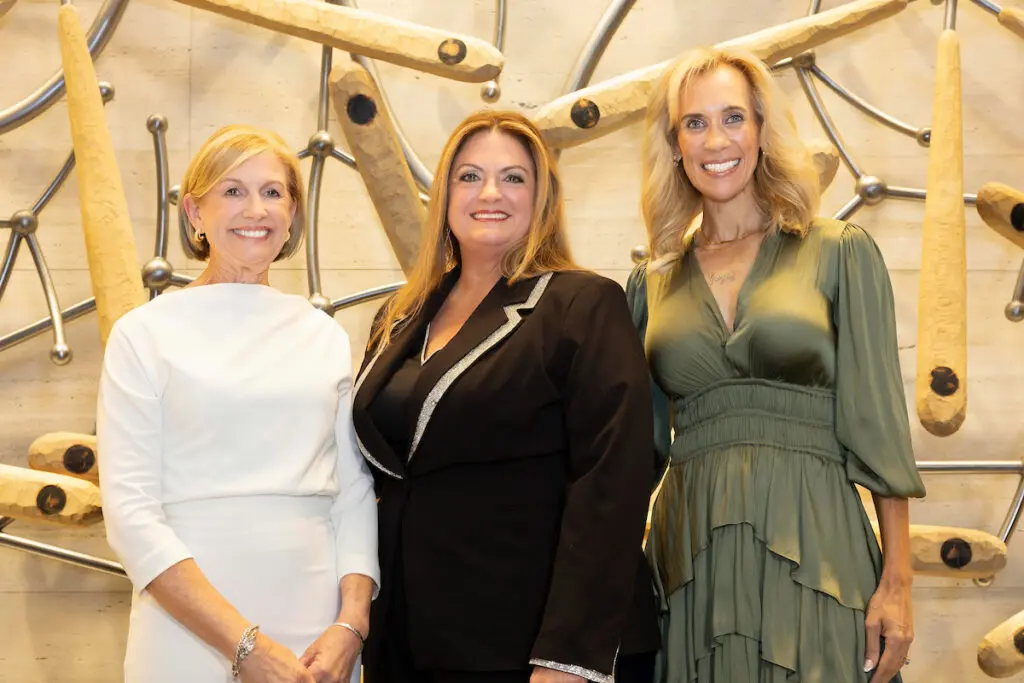 Michele Kooken (center), representing the non-profit YES to YOUTH with Linda Nelson (left) and Missy Herndon at the reception celebrating the newest class of Interfaith's Hometown Heroes. (Photo courtesy of Mauricio Photography)