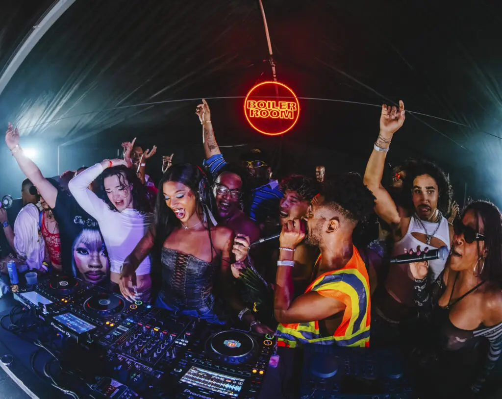 Amarji King performs at Boiler Room in Austin, surrounded by Dollcore and House of Lepore members. (Photo courtesy of Amarji King)