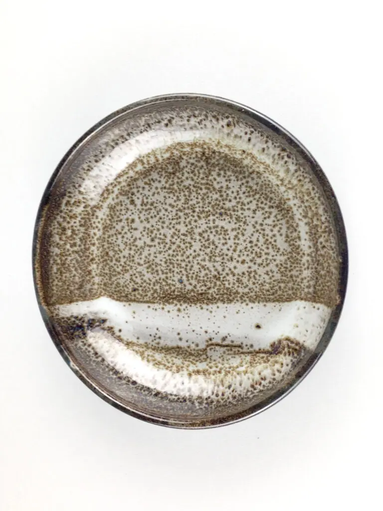 This set of four stoneware bowls features a stunning faux oil spot finish for a touch of elegance. (Photo courtesy Linda Perez Ceramics)
