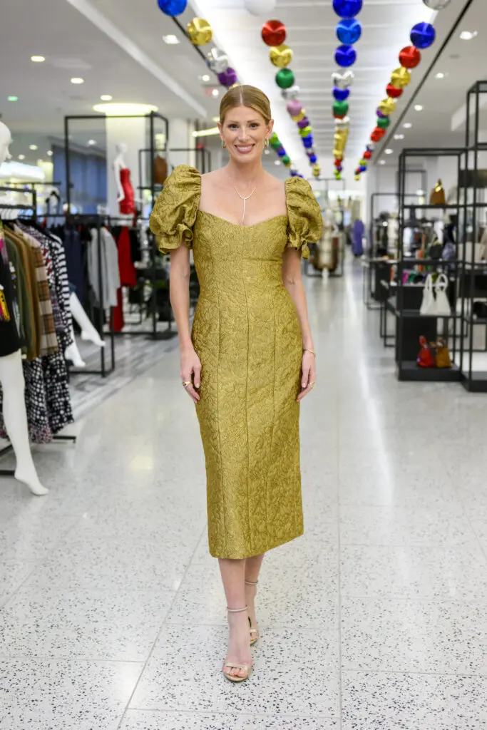 Designer Alexandra O'Neill will be wearing the Farrah Gold Brocade Midi Dress this holiday season.