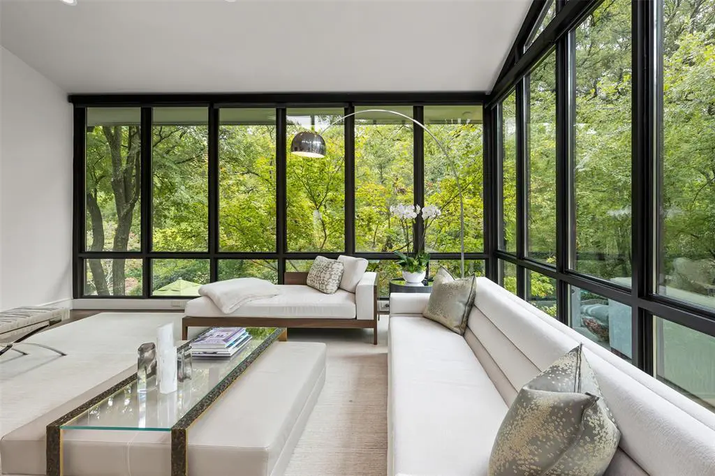 Clean lines, modern appliances, floor-to-ceiling windows, and surrounding greenery make this home in Westover Hills a total win at a $4,950,000 price tag.